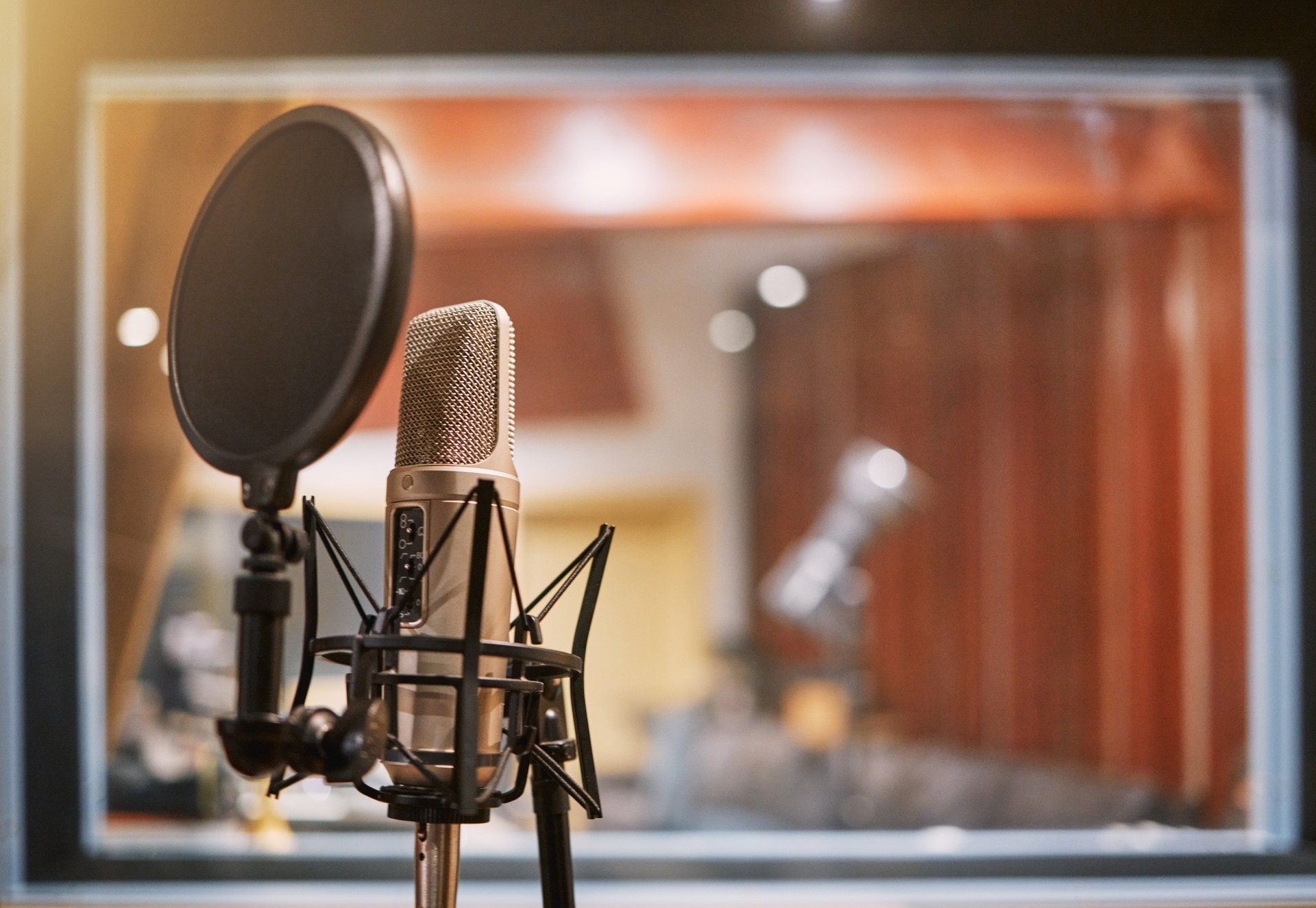 Microphone, studio and music with equipment at a record label for recording audio or sound for the radio. Singing, creative and art with a mic in an empty room for live streaming or production